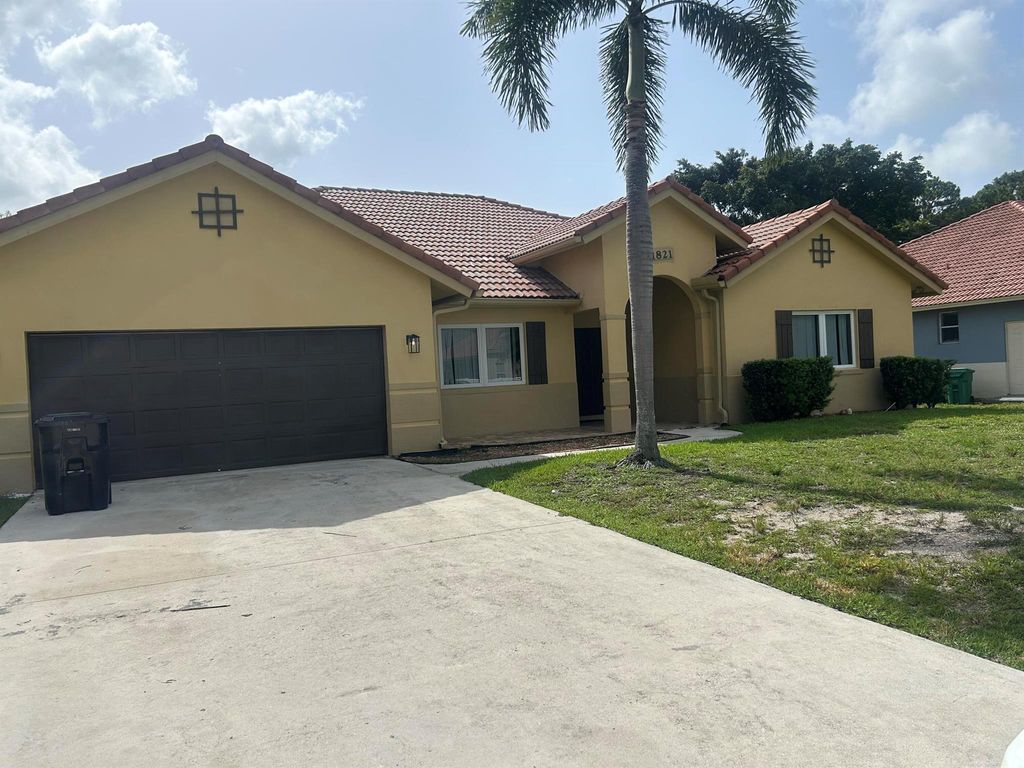 Photo of 1821 SW California Boulevard, Port Saint Lucie, FL 34953 (MLS # R11107135)