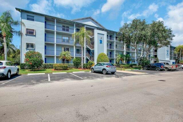 Discover this beautifully upgraded 2nd-floor corner unit in the highly desirable 55+ community of Century Village in Pembroke Pines, offering stunning lake and golf course views. This meticulously maintained 2-bedroom, 2-bath residence features high-end finishes throughout, including modern appliances and an in-unit washer and dryer. Enjoy serene greenery and water views from your enclosed patio--no direct neighbors for ultimate privacy. The unit includes two assigned parking spaces with ample guest parking nearby. Century Village is a gated community offering complimentary transportation, both within and outside the neighborhood. Residents enjoy an impressive clubhouse with classes, clubs, free movies, Broadway-style shows, a state-of-the-art gym, and indoor/outdoor pools. Ideally located