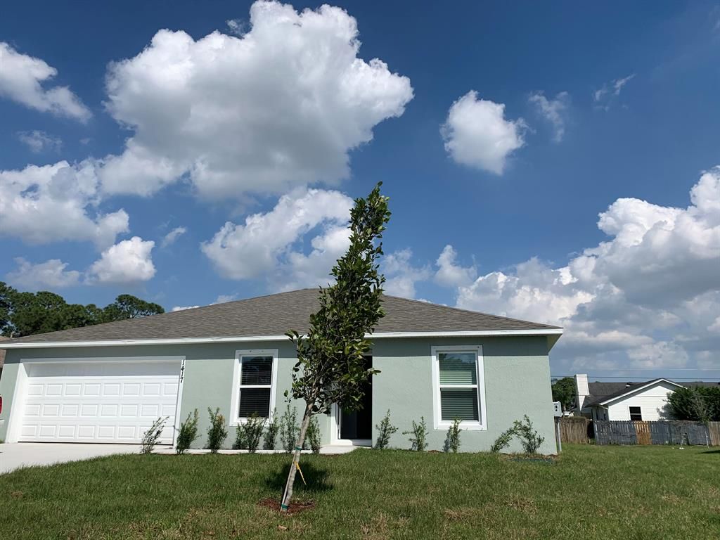 Photo of 1417 SW Navajo Lane, Port Saint Lucie, FL 34983 (MLS # R10696366)