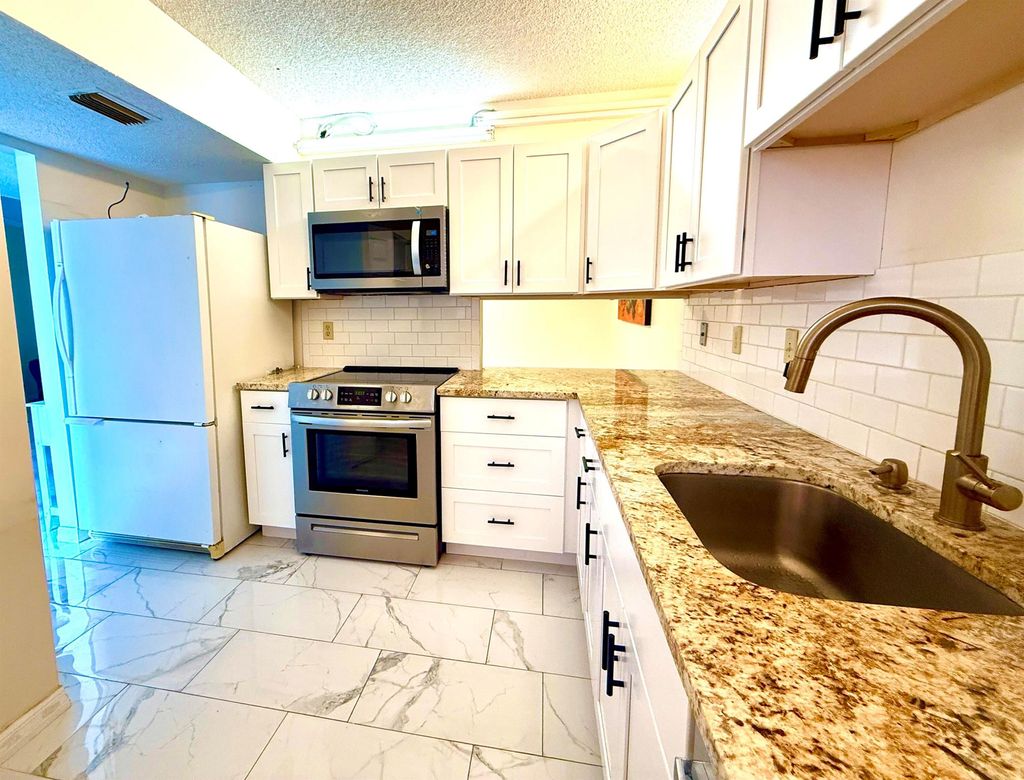 Photo of 1200 SE Parkview Place #F1, Stuart, FL 34994 (MLS # R11117098)