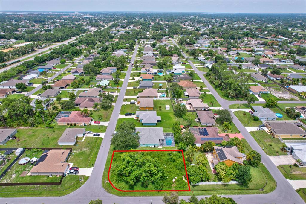 Corner Home site Strategic Location close To i-95 and Turnpike Exit. Close to Shopping Center in a well established neighborhood. Convenience and privacy. Backs to another Home and One Side Neighbor. Easy to Clear Lot to Build $$.