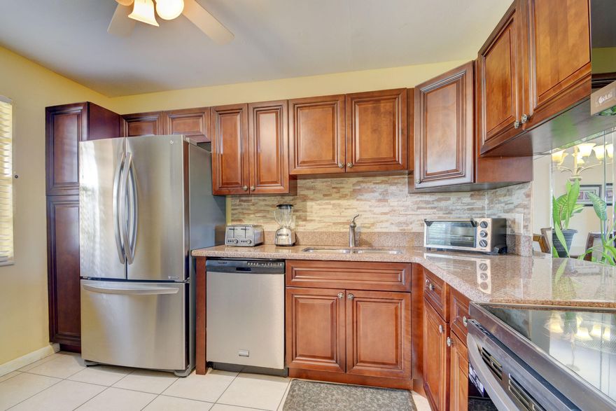 COME ENJOY THIS RENOVATED 2 BEDROOM 2 BATH LAKEFRONT CORNER VILLA IN THE ACTIVE 55+ COMMUNITY OF MAN-GATED GOLDEN LAKES. NO CARPET! PATIO IS ENCLOSED WITH IMPACT GLASS AND FEATURES WOOD LOOK TILE. BRAND NEW AC! GOURMET KITCHEN WITH GRANITE COUNTERTOP AND STAINLESS APPLIANCES.  UPDATED BATHROOMS AND LARGE WALK-IN CLOSET IN THE PRIMARY BEFDROOM. FULL SIZED WASHER AND DRYER IN THE PATIO. INCLUDED IN YOUR MONTHLY MAINTENANCE ARE WATER, XFINITY COMCAST CABLE WITH PREMIUM CHANNELS AND INTERNET.  GOLDEN LAKES IS A WONDERFUL PLACE TO CALLHOME WITH IT'S MANY AMENITIES SUCH AS CLUBHOUSE, POOLS, FITNESS CENTER, BILLIARDS, SPA, HOT TUB, CAFE AND MUCH MORE.  GREAT LOCATION CLOSE TO THE PALM BEACH INTL AIRPORT, BEACHES, SHOPPING, DINING, HEALTH FACILITIES, CITY PLACE & EASY ACCESS TO MAJOR HIGHWAYS!