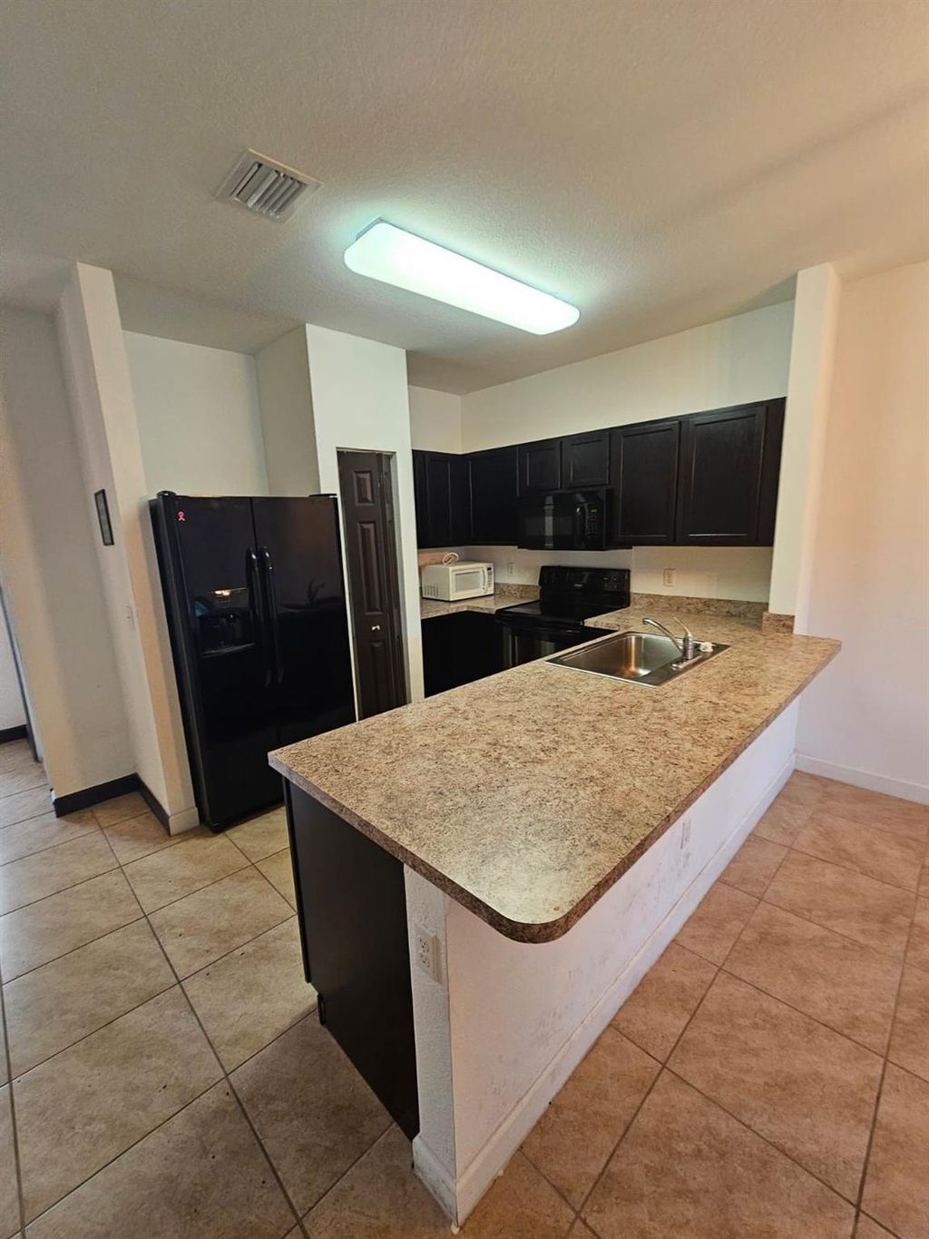Photo of 3552 NW 29th Court #3552, Lauderdale Lakes, FL 33311 (MLS # F10410760)
