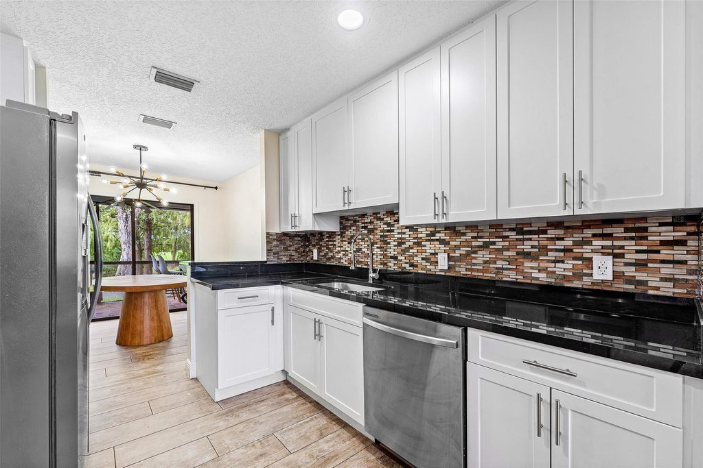 Photo of 1525 Woodbridge Lakes Circle, West Palm Beach, FL 33406 (MLS # F10529696)