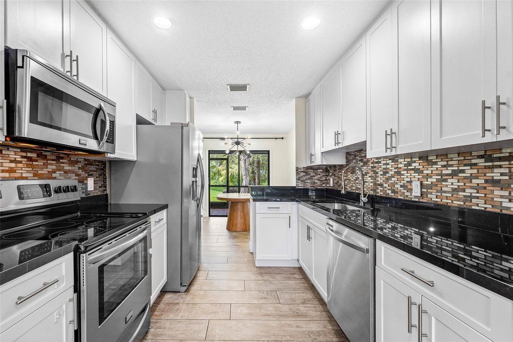 Photo of 1525 Woodbridge Lakes Circle, West Palm Beach, FL 33406 (MLS # F10529696)