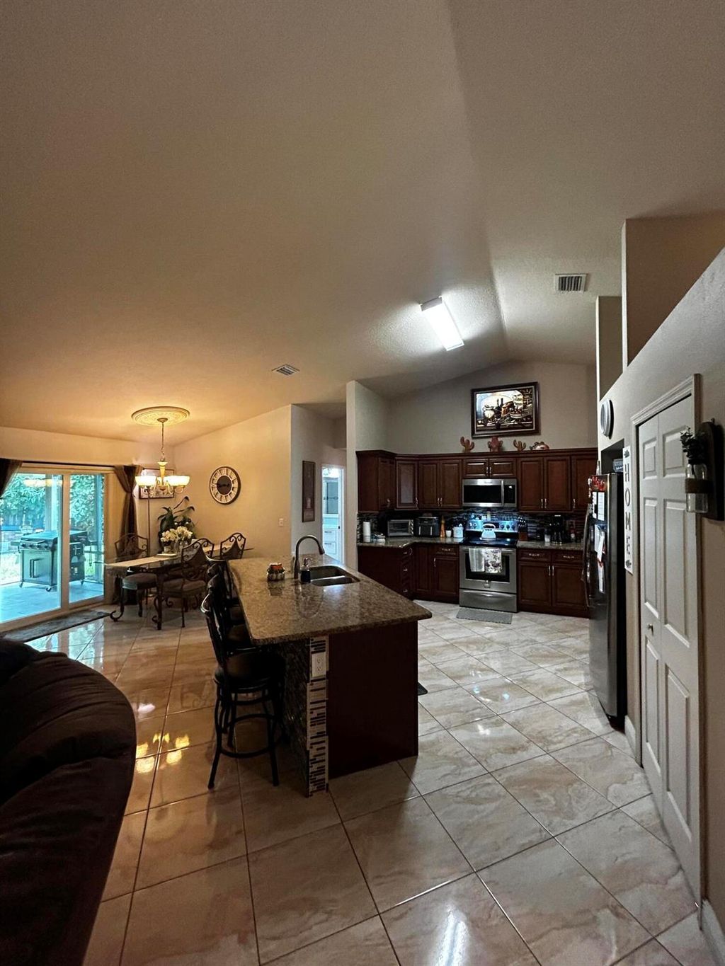 Photo of 4002 SW Kamsler Street, Port Saint Lucie, FL 34953 (MLS # R11012601)