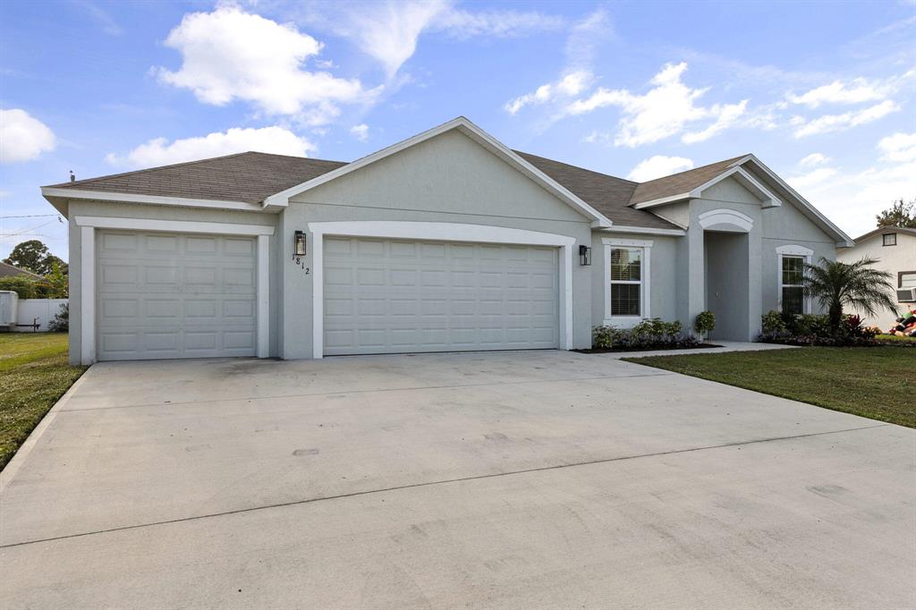 Photo of 1812 SW Hampshire Lane, Port Saint Lucie, FL 34953 (MLS # R10763866)