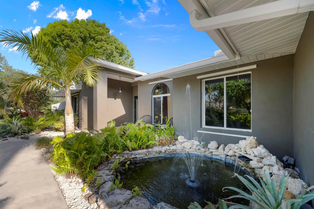 Photo of 3082 NE Ivy Lane, Jensen Beach, FL 34957 (MLS # R10992676)