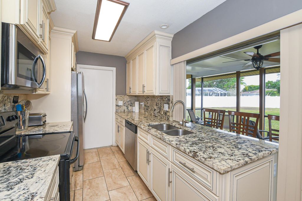 Photo of 610 NW Marion Avenue, Port Saint Lucie, FL 34983 (MLS # R11158235)