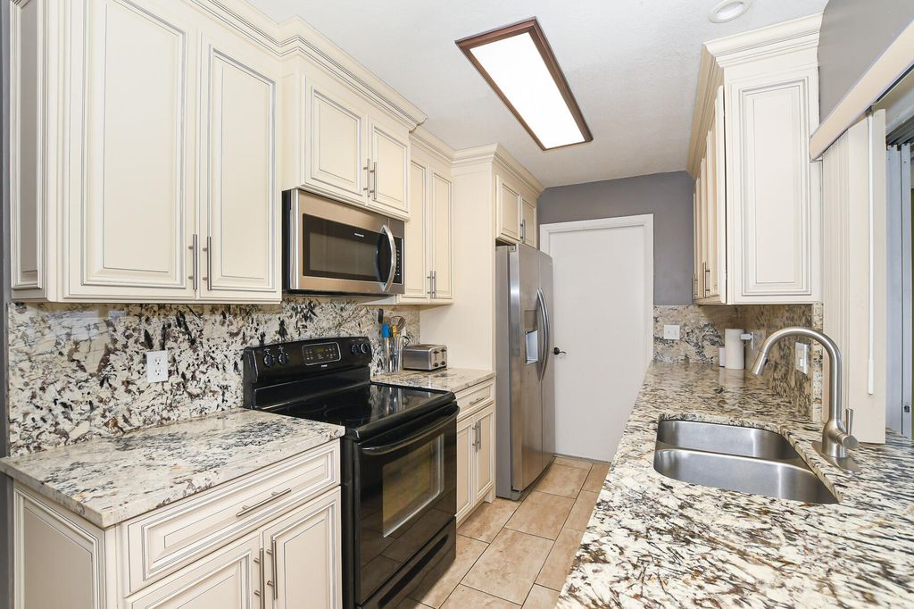 Photo of 610 NW Marion Avenue, Port Saint Lucie, FL 34983 (MLS # R11158235)