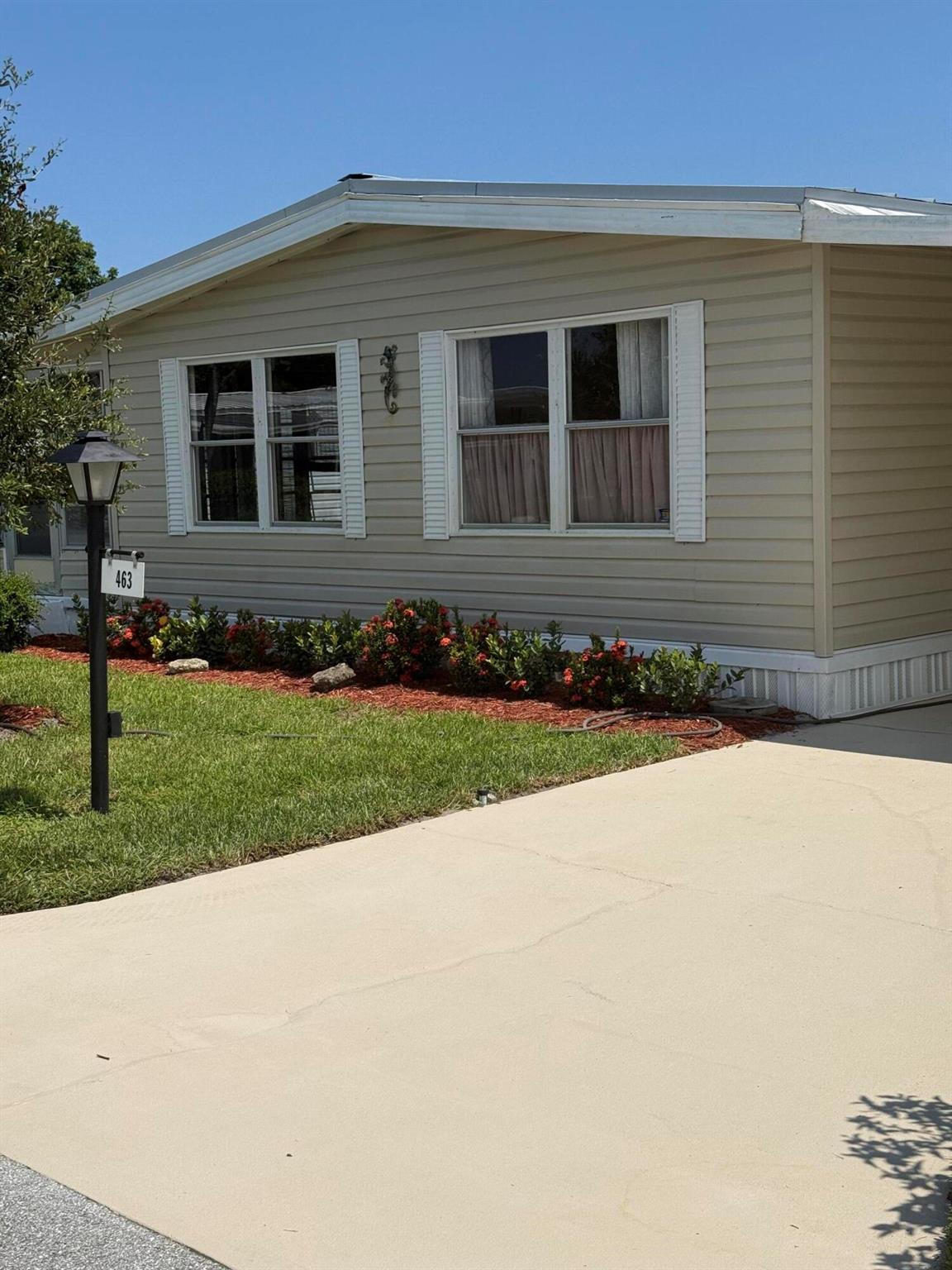 Welcome to 463 Onyx Way, a delightful 2-bedroom, 2-bathroom manufactured home nestled in the sought-after 55+ community of Pinelake Village in Jensen Beach. With 1,440 sq ft of living space, this home offers comfort, convenience, and unbeatable value. I has a spacious living room and large master suite, a bright Florida room perfect for relaxing or entertaining, new metal roof and laminate flooring throughout. There's ample storage with walk-in closets, pantry and large shed. It has an attached carport with 2+ parking spaces. It is on leased land and lot rent is $765 per month. Whether you're looking for a seasonal retreat or a full-time residence, Pinelake Village offers a peaceful lifestyle close to beaches, shopping, and dining.