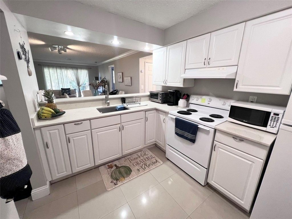 Photo of 1001 NW 45th Street, Deerfield Beach, FL 33064 (MLS # F10492732)