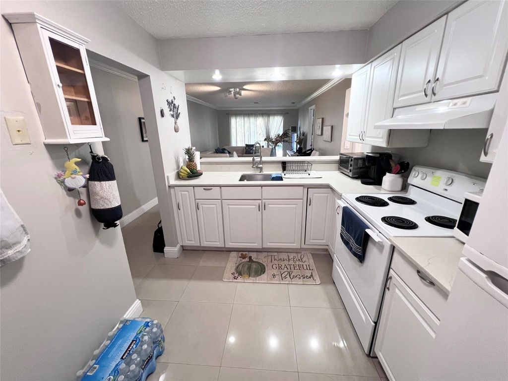 Photo of 1001 NW 45th Street, Deerfield Beach, FL 33064 (MLS # F10492732)