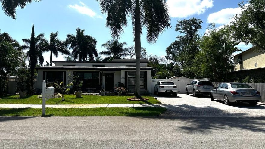 NEW PHOTOS. Great location! Beautifully upgraded 3/2 pool home! Close to US1 and minutes to I-95 and beaches. Situated on a 9,582 lot. Oversized backyard. Large pool with waterfalls. Gourmet covered area by the pool. Beautiful landscape with fruit trees. Perfect for entertaining! Newer AC, new Water Heater. Freshly painted outside. New laminate floors. The kitchen looks new with a water filter under the sink and big cabinets.  Accordion shutters throughout, large laundry with and storage room. Triple split layout, brick paver driveway, and "NO HOA". The Refrigerator in the kitchen is not included. The refrigerator in the laundry is the one included. The patio furniture and decoration are NOT INCLUDED with the sale of the house. A must-see!