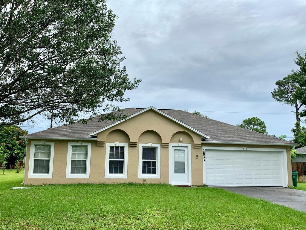 Photo of 1833 SW Lofgren Avenue, Port St Lucie, FL 34953 (MLS # R10907095)