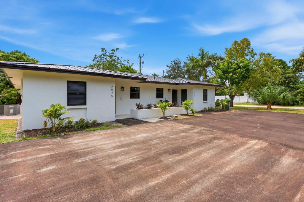 Photo of 2975 NE 2ND Avenue, Boca Raton, FL 33431 (MLS # B26077494)