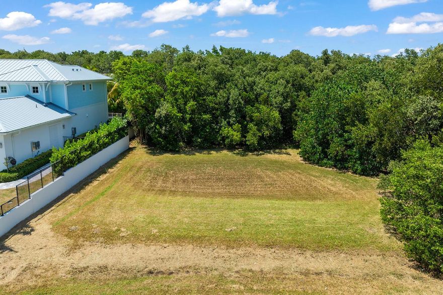 Premium Ocean Ridge Lot - Nearly Permit-Ready! Build a luxury estate on this 0.39-acre lot just a short walk to the beach, only 400 ft from the Intracoastal Waterway. Extensive permitting work is nearing completion. A full FDEP application has been submitted, including wetland delineation, fill estimates, erosion control measures, structural stormwater design, and mitigation credits from Everglades Mitigation Bank. Site plans (Sheets C3 & C4) include retaining walls and post-development elevations.This rare lot offers the potential water views of the passing boats on the Intracoastal. Situated in one of South Florida's most exclusive beachside enclaves. Investors benefit from reduced timelines and risk. High-demand location with limited supply. BRING ALL OFFERS!