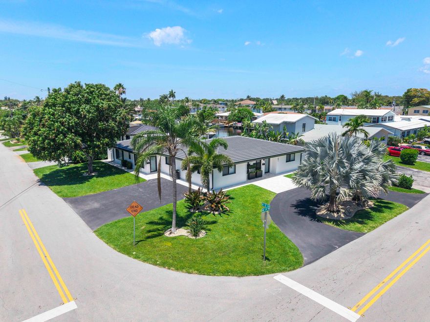 Stunning fully reimagined waterfront duplex in the heart of East Pompano Beach, just approximately one mile from the beach, offering direct canal access and a private dock accommodating up to a 40-foot boat. Completely transformed from top to bottom, this turnkey property seamlessly blends modern design with relaxed coastal living. The duplex features two fully independent units—one 2/2 and one 3/3—each showcasing bright, open floor plans, gourmet kitchens with quartz countertops and stainless steel appliances, beautifully remodeled bathrooms, porcelain flooring, smooth walls, and sleek contemporary finishes throughout. All major systems have been replaced, including a new roof, electrical and plumbing systems, central HVAC with new ductwork, impact windows and doors, providing peace of mind and low maintenance for years to come. The exterior offers strong curb appeal and a serene waterfront setting ideal for relaxing or entertaining, with updated landscaping, driveway and walkways, exterior lighting, fencing, and travertine accents. Separate meters, individual HVAC systems, private entrances, and upgraded safety features further enhance the functionality and appeal of this exceptional property. Perfectly positioned just west of US1 in one of Pompano Beach's most desirable neighborhoods, this rare offering is ideally suited for an owner-occupant looking to live in one unit while renting the other, or for investors seeking flexibility, income potential, and long term value. Enjoy all that Pompano Beach has to offer—from its beautiful beaches, vibrant downtown, and new pier to boating, dining, and entertainment—while owning a fully rebuilt waterfront property designed for modern coastal living.
