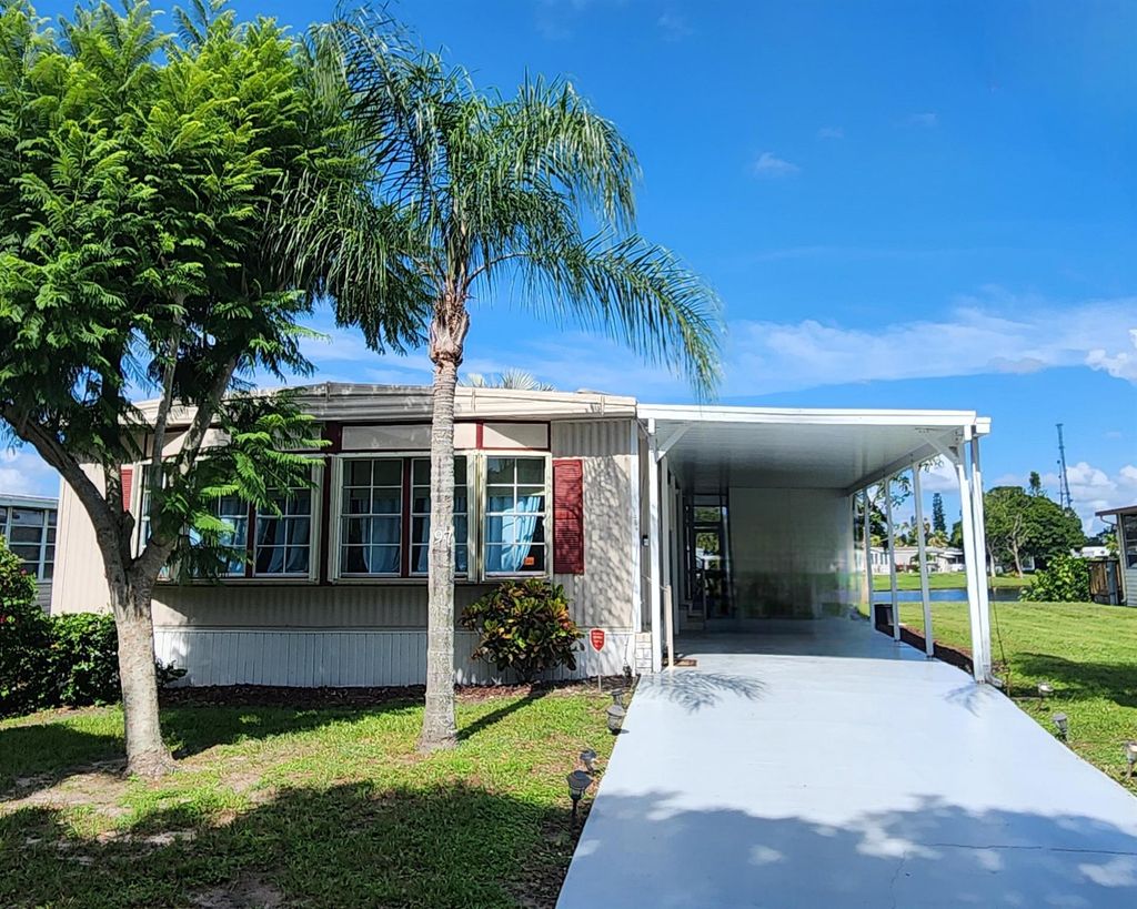 Photo of 97 W Caribbean, Port Saint Lucie, FL 34952 (MLS # R11005864)