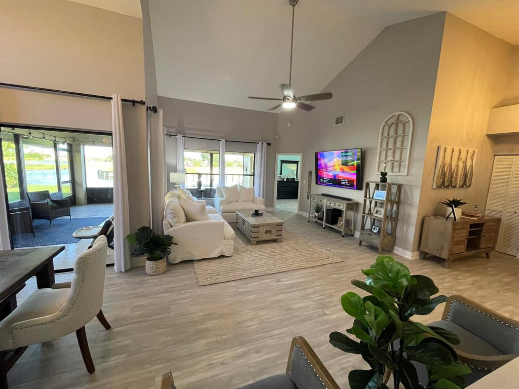 Gorgeous lake and golf course island views from this oversized 2BR/2BA home in Cambridge of Boynton! Custom redesigned and renovated Kitchen and Family room highlights this light and bright open floorplan with many recent updates. Impressive Gourmet Kitchen with European flair. Beautiful views from the 350 sq ft extended screened patio with a covered lanai. Lanai could easily flex into a 3rd bedroom if desired. This meticulously maintained single family detached home features two Master suites with large en-suite bathrooms. All age community with excellent schools. Bring your highest and best offers.