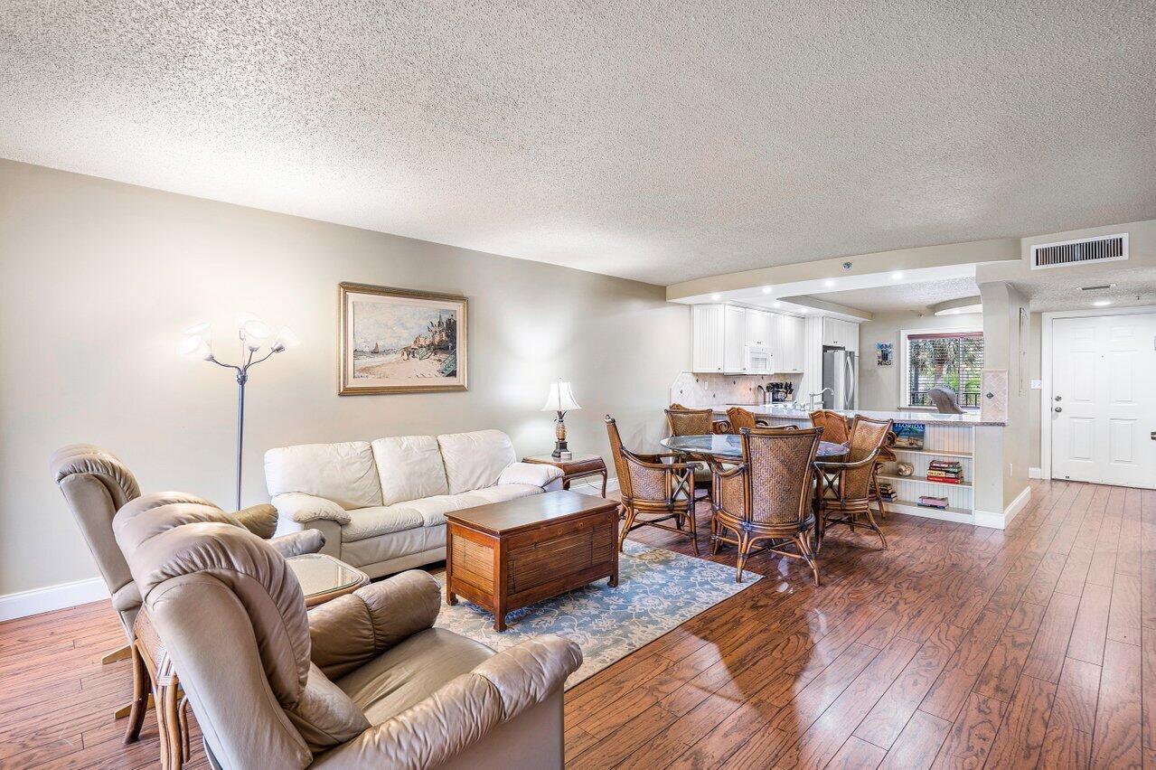 Your Dream Winter Getaway in Jupiter Bay! Looking for the perfect coastal escape? This stunning 2BR/2BA condo at Jupiter Bay Resort has it all--starting with a beautiful open kitchen featuring sleek granite countertops and warm wood floors throughout (no carpet). Fully furnished with a spacious king primary suite and twin guest bedroom, it's ideal for families, snowbirds, or weekend getaways with friends. Whether you're chasing sunshine in the winter or planning the ultimate summer stay, you'll love being just a short walk to the beach, shopping, and dining. This one's turnkey and ready--are you?