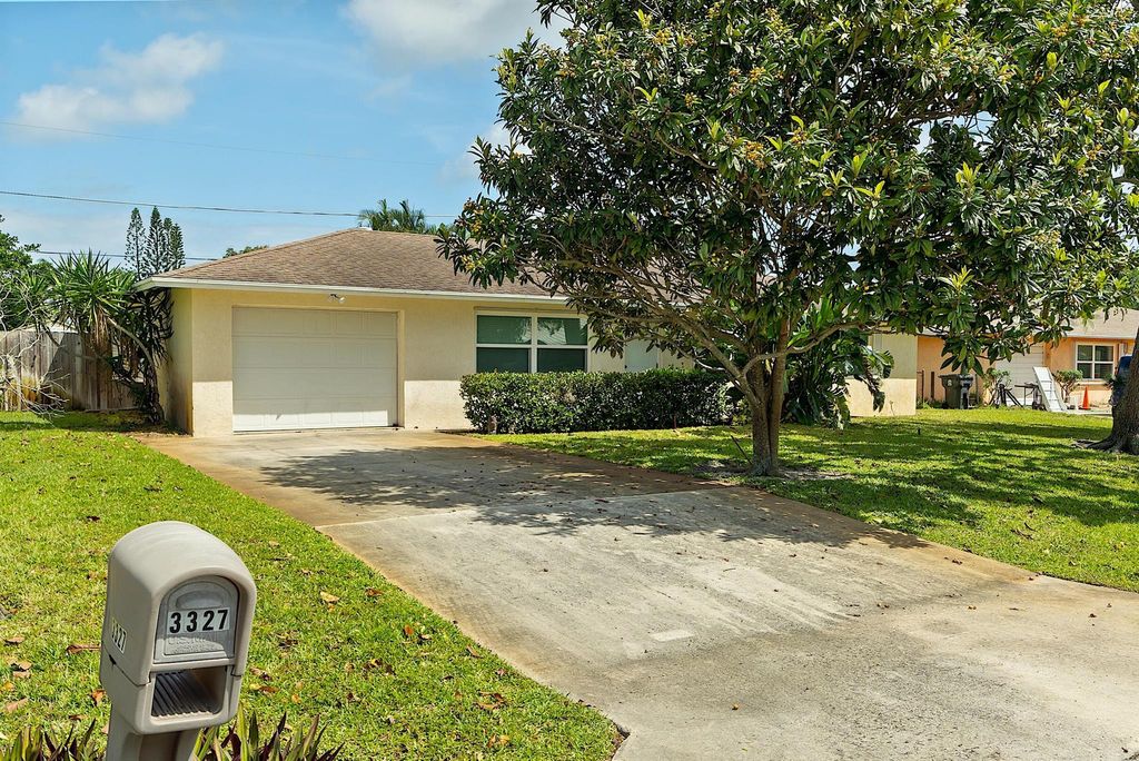 Photo of 3327 Diamondhead Road, Lake Worth, FL 33462 (MLS # R10972142)