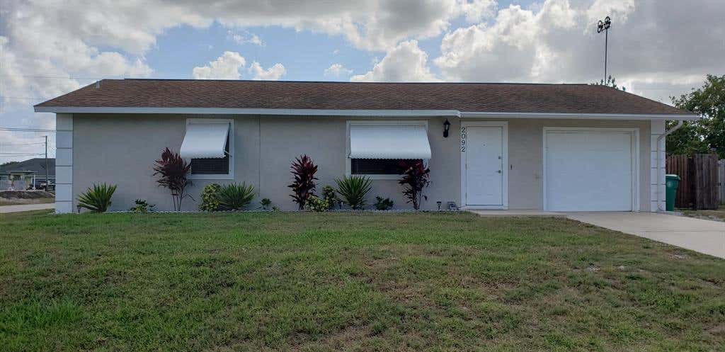 Photo of 2092 SW Cameo Boulevard Blvd, Port St Lucie, FL 34953 (MLS # R10720102)