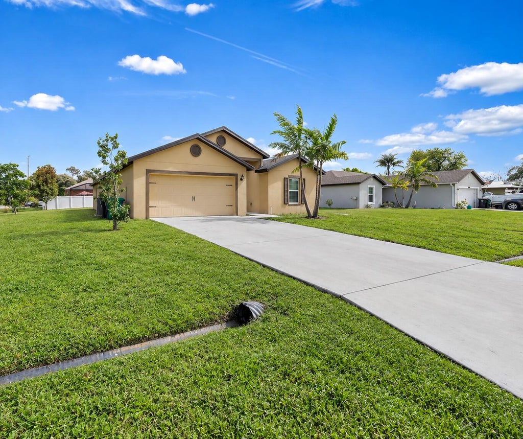 Photo of 1597 SW LEISURE Lane, Port Saint Lucie, FL 34953 (MLS # B26080164)
