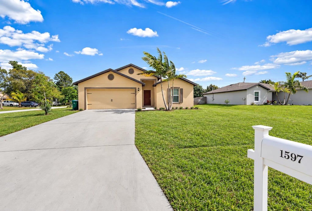 Photo of 1597 SW LEISURE Lane, Port Saint Lucie, FL 34953 (MLS # B26080164)