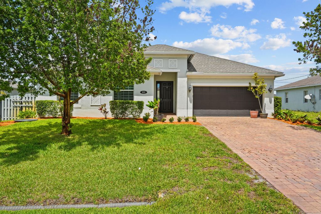 Photo of 691 SW Haas Avenue, Port Saint Lucie, FL 34953 (MLS # B26015583)