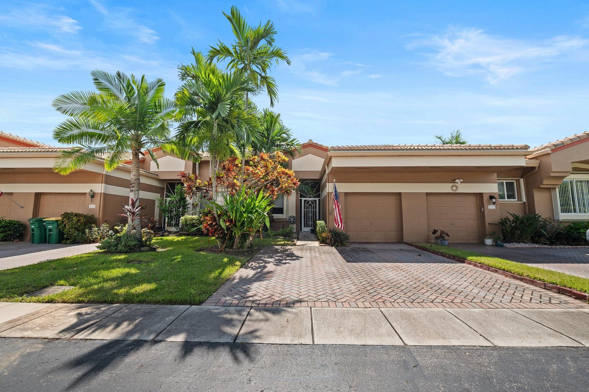 Welcome to this charming 2-bedroom villa in the highly sought-after Lombardy section of Kings Point, a vibrant 55+ community. This pet-friendly home offers high ceilings throughout, a spacious remodeled kitchen with ample cabinetry and pullouts, and a large primary bedroom featuring two walk-in closets and private access to the patio. The primary bath boasts a Roman tub, separate shower, and dual sinks. Enjoy a tranquil garden view from the large screened patio, and rest easy with hurricane panels for added security. The community allows pets under 35 lbs and provides outstanding amenities, including a 60,000 sq ft clubhouse, indoor and outdoor pools, a 1,000-seat theater, an exercise room, clubs, bus transportation. CAR CHARGING SETUP,MURPHY BED SET INCLUDED, other Furniture negotiable.