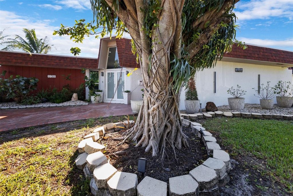 Photo of 5702 Melaleuca Drive, Tamarac, FL 33319 (MLS # F10549078)