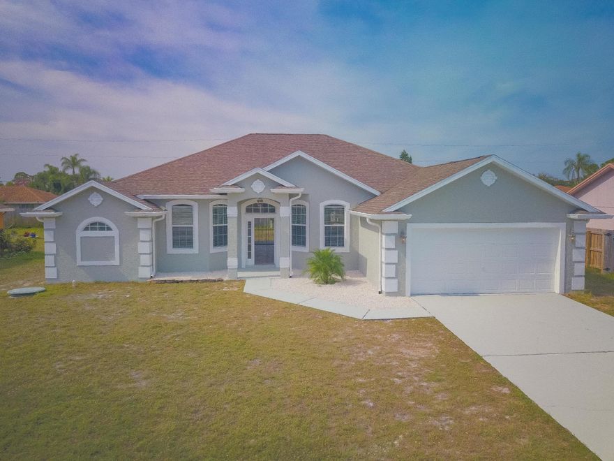 AMAZING HOME!! Completely remodeled 4/3/2 home in the heart of beautiful Port St. Lucie. DESIRABLE LOCATION! The spacious kitchen has brand new stainless steel appliances accompanied by a semi-formal dining / family room with fireplace and double sliding doors that leads to a large screened in patio. Tile throughout the living areas and brand new flooring in the bedrooms. Master bedroom suite features dual sinks, a soaking tub with a separate glass shower and two large walk in closets. Freshly painted with super clean edges and modern colors makes this one of the best, turn-key listings in Port Saint Lucie. Perfectly situated near banking, shopping, restaurants, and interstate access.