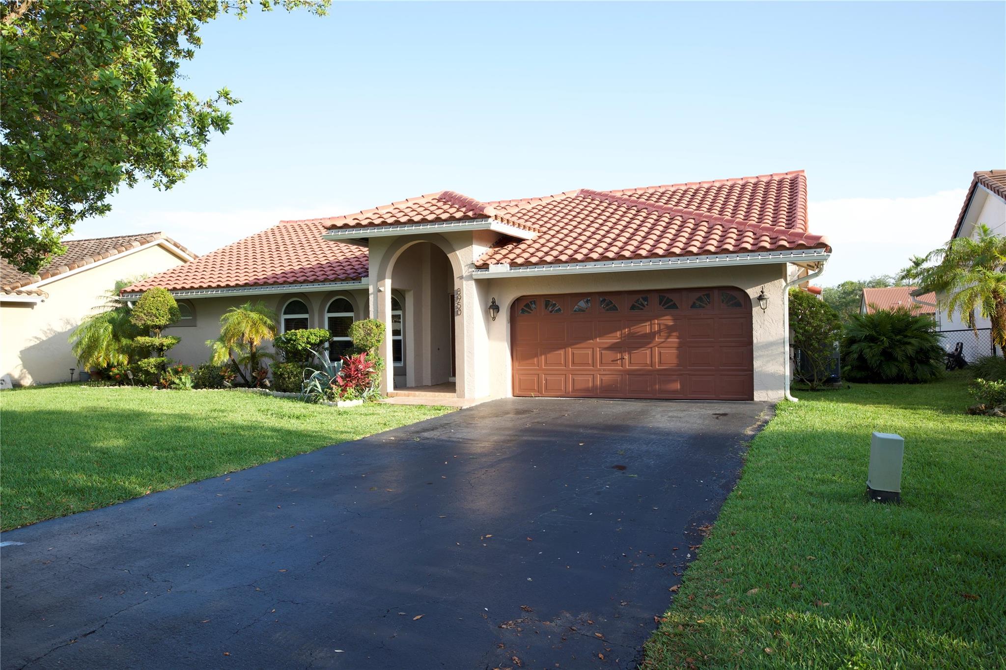Assumable FHA Loan with 4% interest rate! This move-in ready home has all the big-ticket upgrades done for you! Enjoy peace of mind with a new barrel tile roof (2023) and hurricane impact windows. Inside, you’ll find a fully renovated oversized kitchen with granite countertops and stainless steel appliances. The home features Vinyl Floors & a bright, open split floor plan. The spacious primary suite includes a custom California closet and a luxurious bathroom with double sinks, a frameless glass shower, and a jacuzzi tub. A cabana-style guest bath opens to the patio—perfect for entertaining by the pool. The laundry room has been updated with new floors and fresh paint. Fenced yard, screened-in covered patio, and a pool with a newer pump (2022).