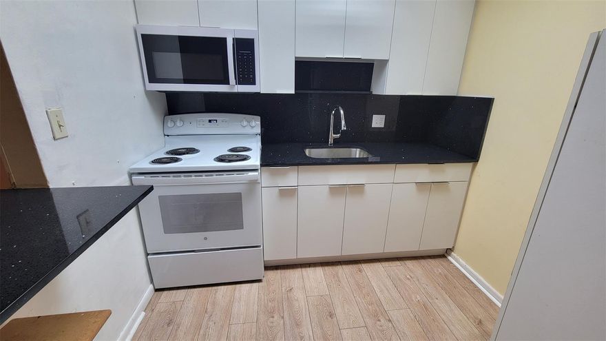 BEAUTIFUL BRAND NEW KITCHEN CABINETS NEW COUNTER TOPS JUST INSTALLED.  NICE LARGE COUNTER TOP IN KITCHEN.  EXCELLENT PRICE FOR THIS UNIT LOCATED IN SOUGHT AFTER “CENTURY VILLAGE”. THIS UNIT OFFERS AN EAT IN KITCHEN, LARGE COVERED & ENCLOSED PATIO, NEW MICROWAVE, NEW REFRIGERATOR, NEW STOVE, CEILING FANS. WATER & BASIC CABLE INCLUD IN RENT. THIS COMMUNITY OFFERS TONS OF AMENITIES INCLUDING A MAGNIFICENT CLUBHOUSE WHICH HAS TONS OF SHOWS & ENTERTAINMENT, TRANSPORTATION TO SHOPPING, 24 HOUR GUARD GATE, COMM POOLS, TENNIS, REC ROOM, BILLARD ROOM, GYM, & MUCH MORE.  THIS UNIT ALSO HAS ACCORDION SHUTTERS. PROPERTY IS VACANT & READY FOR IMMEDIATE OCCUPANCY.
