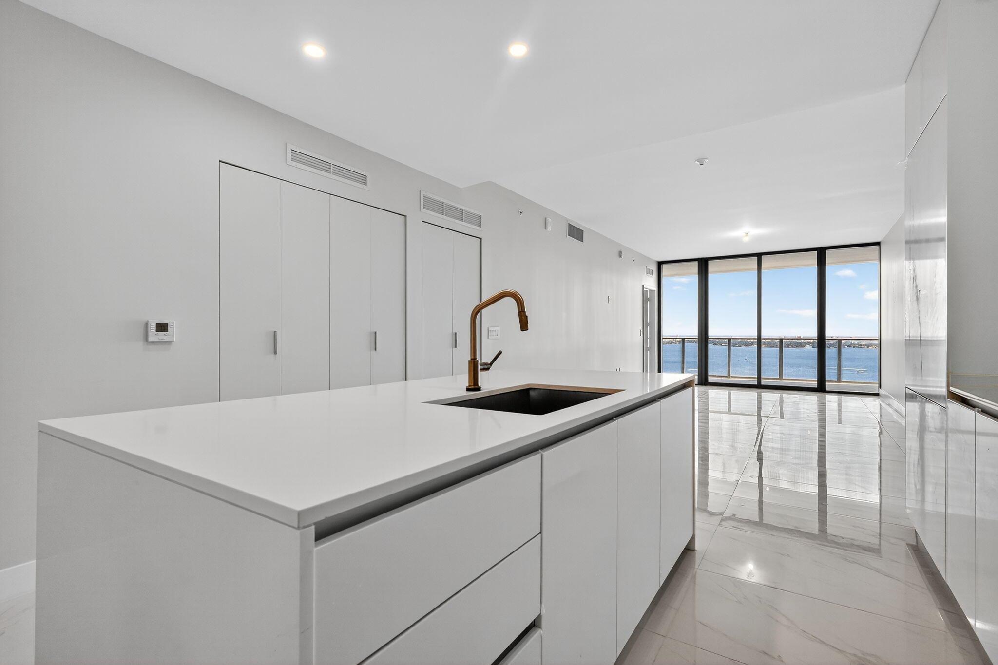 Skip the standard listings! This Aria Reserve South Tower residence redefines bayfront living.  Stunning water and city views, with custom closets, designer drapes, premium shades, and new lighting already in place. Offered furnished at $10,500 (ready in 2 weeks) or unfurnished at $9,500, both move-in ready. Features 2 bedrooms plus office, 3 baths, 1 garage space and 1 valet. Sleek open kitchen with island seating and built-in appliances. Enjoy resort amenities including pool, spa, gym, sports courts, kids areas, and a private wine cellar in Miami's most connected neighborhood, steps from Whole Foods, Trader Joe's, Midtown, Wynwood, and the beach.