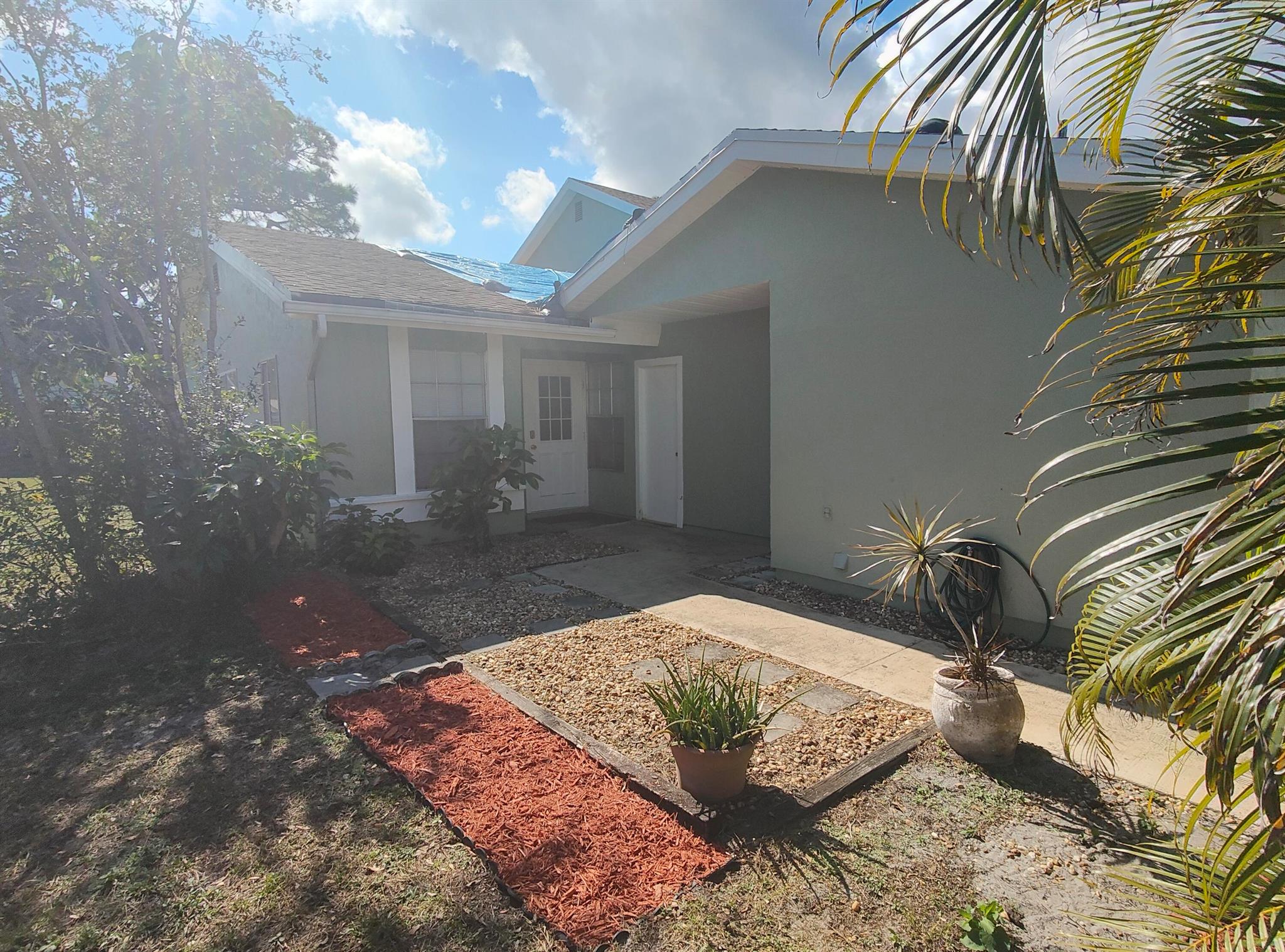NEW ROOF IN 2025. Perfect opportunity to own a property at an affordable price in Port St Lucie. This 2 bedroom 1 bathroom townhouse is centrally located close to shopping, banking and entertainment. Drive only 30 minutes to the Beach. Townhouse has 1 car garage. A full size washer and dryer in the Garage. Quite community and low HOA fees which includes Pool, Lawn Care, & Cable. Bring your family and pet to live in this community. You will be glad you did. The Price is right for a quick sale.
