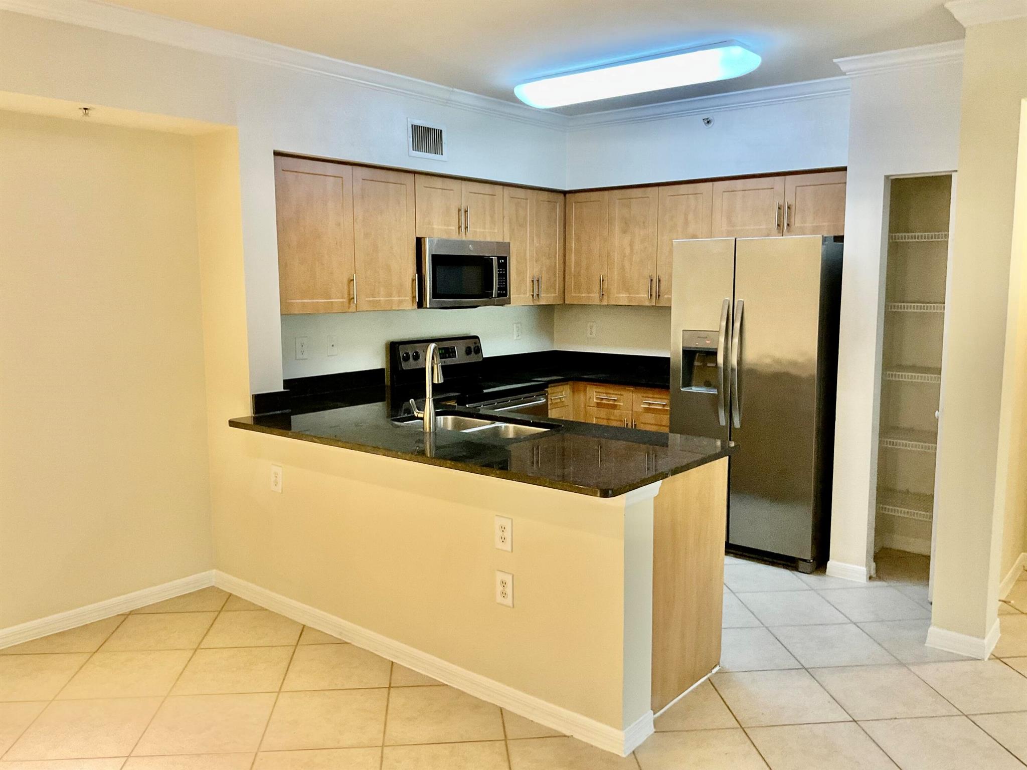 The Villas at Emerald Dunes is a unique resort style community, located on lush tropical grounds, surrounded by a world renowned, golfcCourse. This one-of-a-kind community not only offers stunning views, exceptional quality and so much more. Just a few of our features include private terraces/screened porches, full size washer/dryer, walk-in closets, granite countertops, stainless steel appliances, garden tubs. All units have crown molding in living room & dining room, hurricane resistant windows, tile flooring throughout, LVP in bedrooms. Unit comes with carport and uncovered space. Included in rent water/sewer, trash & basic cable. Amenities include 2 resort style swimming pools w/sundeck, mediation garden, picnic/grilling areas, controlled access gates. 2 state of the art gyms.