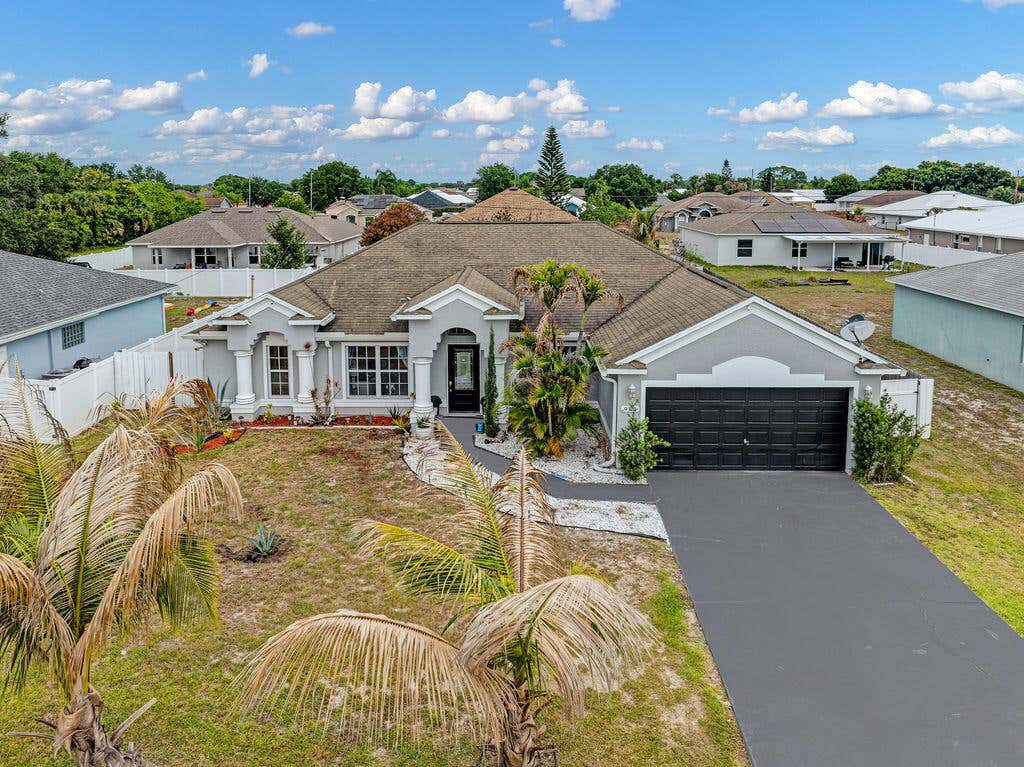 Photo of 981 SW Mccomkle Avenue, Port Saint Lucie, FL 34953 (MLS # B26040274)