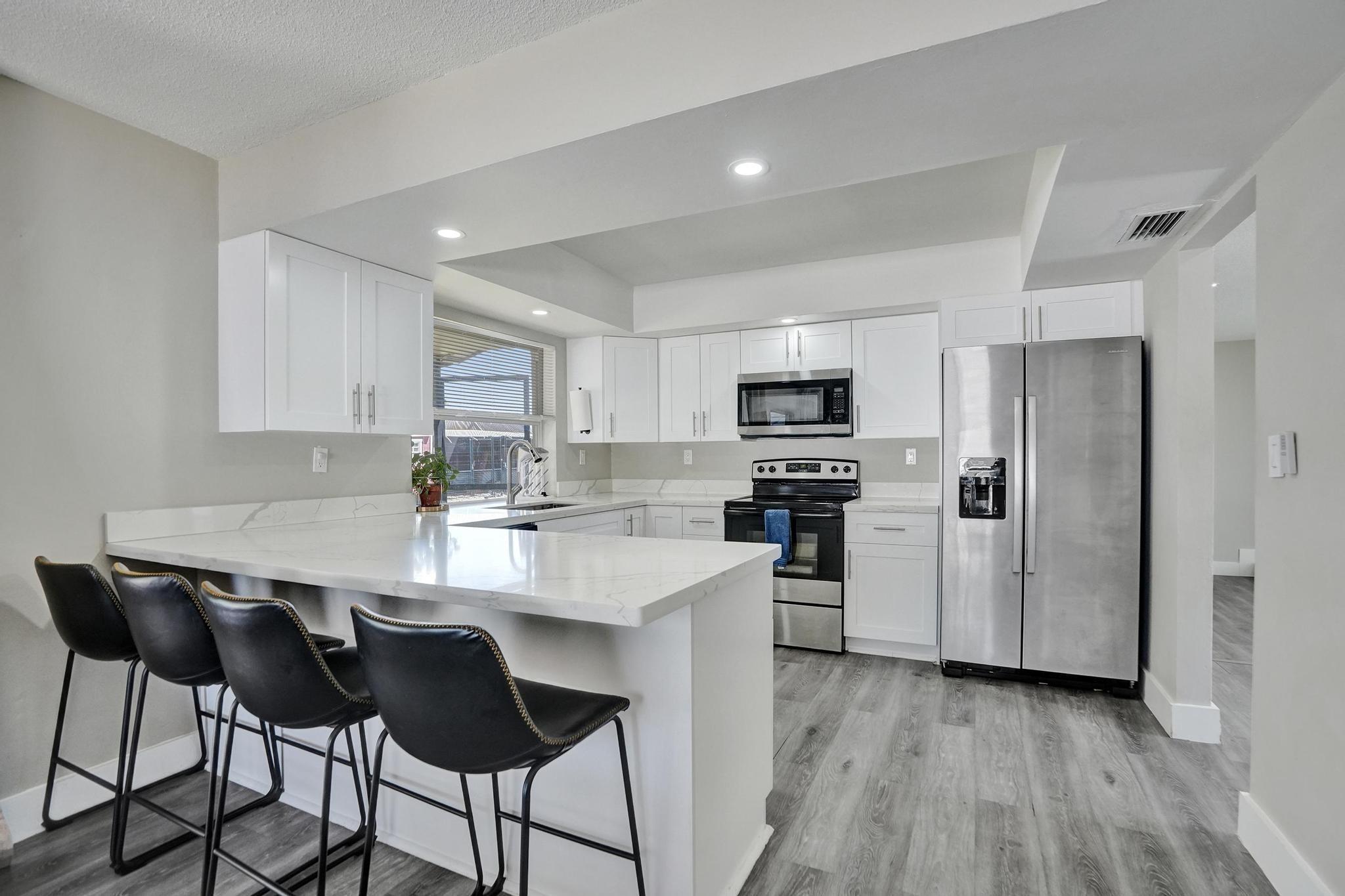 Don’t miss this stunning 3-bed, 2-bath corner-lot beauty—renovated top to bottom and ready for you! The gourmet kitchen boasts quartz counters, shaker cabinets, breakfast bar and NEW Stainless Steel appliances, while spa-like baths shine with sleek quartz vanities. Updates include NEW A/C, ductwork, NEW impact windows/doors, NEW washer/dryer, NEW water heater, NEW LED lighting, and stylish laminate floors. Step outside to a huge screened patio and PVC fenced yard with hot tub canopy—perfect for BBQs and fun! Double gates for boat, RV, jet skis storage plus 1-car garage. NO HOA and an unbeatable location near parks, dining, and highways—this rare find won’t last!