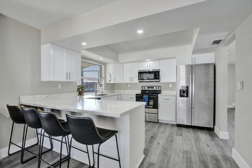 Don’t miss this stunning 3-bed, 2-bath corner-lot beauty—renovated top to bottom and ready for you! The gourmet kitchen boasts quartz counters, shaker cabinets, breakfast bar and NEW Stainless Steel appliances, while spa-like baths shine with sleek quartz vanities. Updates include NEW A/C, ductwork, NEW impact windows/doors, NEW washer/dryer, NEW water heater, NEW LED lighting, and stylish laminate floors. Step outside to a huge screened patio and PVC fenced yard with hot tub canopy—perfect for BBQs and fun! Double gates for boat, RV, jet skis storage plus 1-car garage. NO HOA and an unbeatable location near parks, dining, and highways—this rare find won’t last!