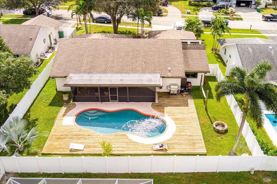 Rare find in highly sought-after Rolling Hills Estates--priced under $700K! This 3BR/2BA pool home offers the perfect blend of comfort and convenience with no HOA. Enjoy peace of mind with a 2022 roof, 2022 resurfaced saltwater pool, 2021 water heater, and 2018 HVAC. The fenced yard provides privacy. Spacious layout includes a family room opening to an oversized screened lanai, perfect for entertaining, plus a great room and bonus room off the kitchen. The primary suite features a cabana bath with easy pool access. Located near A-rated schools, Nova University, shopping, restaurants, and entertainment--this one won't last!