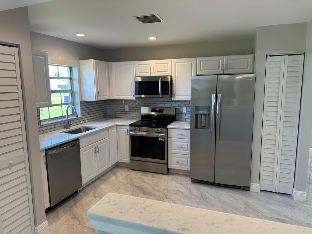 Photo of 5796 Moss Court #7, Fort Pierce, FL 34982 (MLS # B26026100)