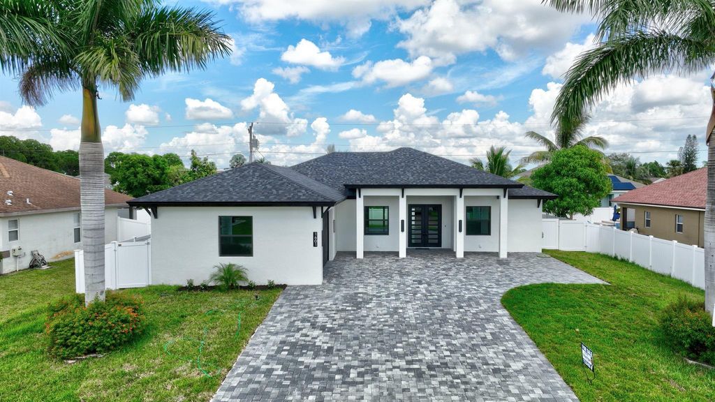 Photo of 1601 SW Neptune Avenue, Port St Lucie, FL 34953 (MLS # R10920234)