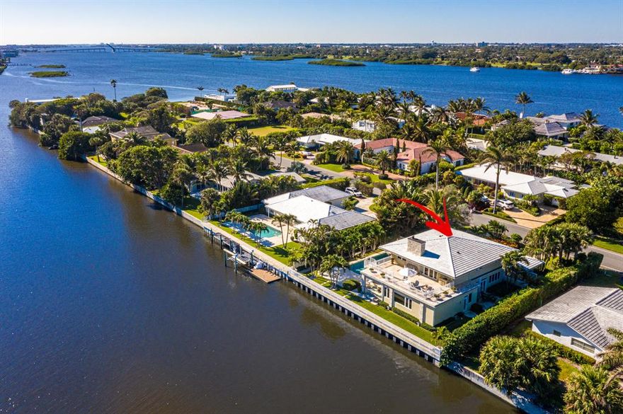 Beautiful totally renovated contemporary waterfront home on desirable Ibis Isle in Palm Beach. Large impact windows and doors lead out to the gardens and spacious pool area with a full summer kitchen and overlooking the east Intracoastal Waterway. Great for entertaining! A staircase from the terrace leads to a 2nd story waterfront deck. Watch the abundant bird life and boats go by while enjoying the breezes from the nearby Ocean. The home has an open floorplan with marble floors, coquina columns, and fireplace. Other features include a chefs kitchen with a gas stove, stylish baths, ample closets, large family room on the 1st level, and an office off the master bedroom. The home also offers a whole house water filtration system, state of the art generator, two car garage, and private entry. The island of Ibis Isle is extremely well located across A1A from Phipps Ocean Park, Palm Beach Tennis Center, and Palm Beach Par 3 Golf Course with clubhouse and award winning restaurant. Short drive to 5 Star hotels, Worth Avenue, fine dining, and cultural centers. Installing a dock for small boating sports is permitted.