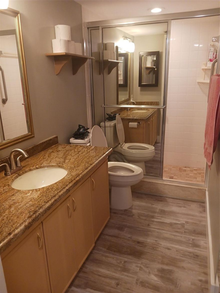 55 PLUS GATED COMMUNITY CALLED WYNMOOR-  2/2 BEAUTIFUL TOTALLY UPGRADED GROUND FLOOR UNIT. Neutral laminate floors throughout.  Breathtaking view of the 4th hole of the golf course from the glass enclosed patio. This unit can be rented on an annual basis fully or partially furnished or even unfurnished if desired  Parking space directly in front of the unit. Unit is across from the satellite pool. Use of a Golf cart can be included in the rental.