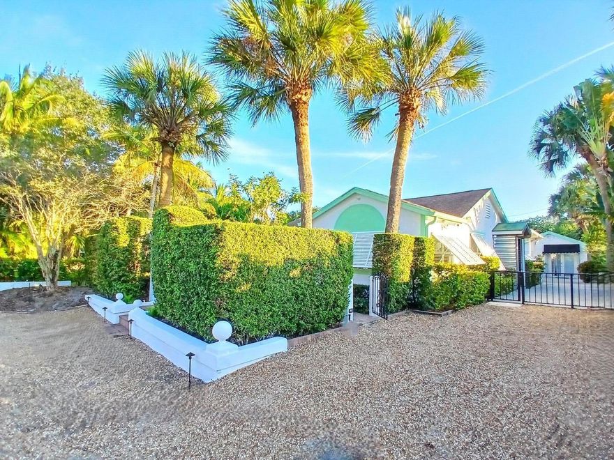 Stunning Coastal Home with Private Casita, Heated Pool & Spa — Steps from the Intracoastal. Welcome to this rare coastal sanctuary just one block from the Intracoastal & less than a mile to the beach & downtown. Behind a custom iron gate & 9‑ft privacy wall, you're greeted by a beautifully landscaped garden w/ a soothing central fountain, setting the tone for the tranquility and charm found throughout the property. The main home offers 3 bedrooms & 2.5 bathrooms, including a flexible third bedroom that easily converts into an office or guest room. Freshly renovated w/ coastal-inspired finishes, the home features neutral tones, new lighting, hurricane‑impact windows & doors, updated electrical, new A/C (2024), and a new roof scheduled for 2026. The separate casita provides the 4th bedroom and a full bathroom, plus an outdoor shower, a custom builtin grill station, and additional large storage and a workshop tucked behind it  ideal for hobbies, tools, or gear. Step into your private tropical oasis: a heated pool and spa, expansive covered & raised deck/patio, two dedicated lounge areas & a serene space designed for yoga or meditation. Mature, towering palms line the perimeter, creating complete privacy and a lush resortstyle atmosphere. Perfect as a primary residence, vacation home, or highperforming investment property.

Seller Incentive:  
Seller is offering a full reroof credit or complete roof replacement prior to closing  buyer's choice. 

Recent Upgrades Include:
Fresh exterior & interior paint
New awnings (main house & casita)
New pool heater
New fencing
New air conditioner
New interior & exterior lighting
Hurricaneimpact windows & sliders
Updated window treatments
New outdoor grill station
New landscaping
Pest control & transferable termite bond
New roof for main house & casita (credit or replacement available)