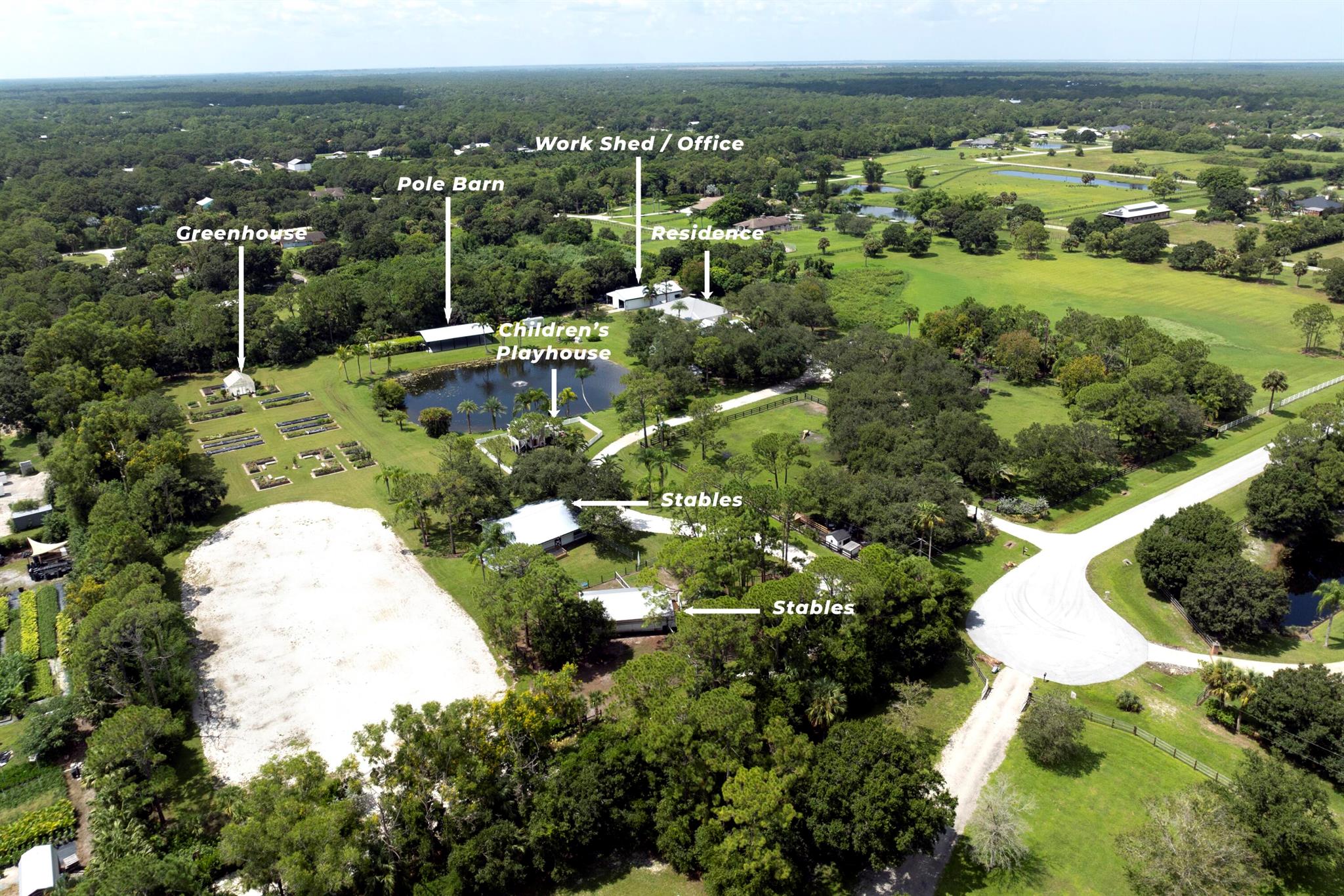 Welcome to The Seven Oaks Ranch, a truly enchanting 9.8-acre estate located at 5004 Southwest Martin Commons Way in the picturesque Palm City. As you approach this magnificent property, you're greeted by a grand, gated entrance that opens to a storybook setting. A tree-lined, winding drive meanders through the lush landscape, where dozens of majestic oak trees stand proudly alongside mature vegetation, creating a serene and private retreat. Nestled amidst this verdant paradise is a beautifully renovated, custom-designed 2-bedroom, 2-bath country cottage. The cottage exudes rustic charm with its screened-in front porch, perfect for sipping morning coffee while soaking in the tranquil surroundings.