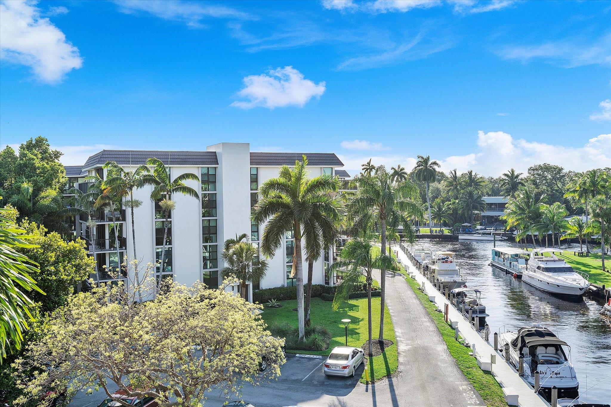 Seller says SELL!! Step into this partially Furnitured beautifully renovated split 2B/2B corner unit, the largest available. The floor to ceiling impact windows flood the space with natural light & showcase stunning, unobstructed views of the New River waterway from its spacious balcony,views of downtown Ft Laud from its bedroom windows. Inside, you'll find a fully updated kitchen, bar, modern bathroom & stylish flooring throughout. Covered garage parking adds everyday convenience next to elevators. Located on a private island, the community offers 3 pools, tennis courts, a newly renovated gym, a clubhouse for social gatherings/security guardhouse. Perfectly positioned just 10 min drive from Las Olas Bars/restaurants & downtown Fort Lauderdale, world-class beaches, airport/Port Everglades,