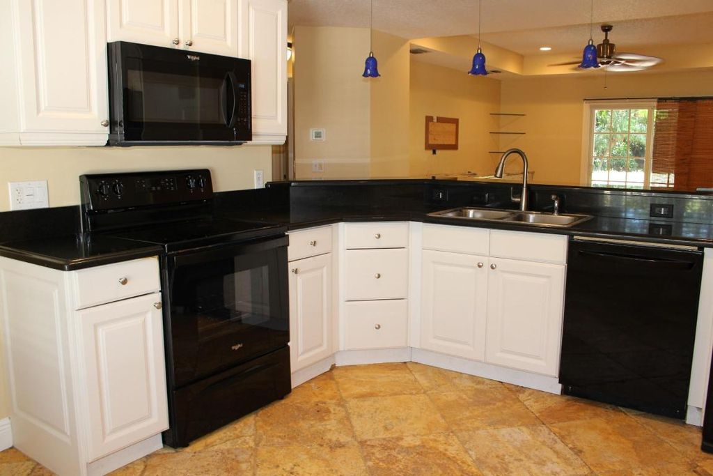 Photo of 5820 SE Wesley Avenue, Stuart, FL 34997 (MLS # R10991546)